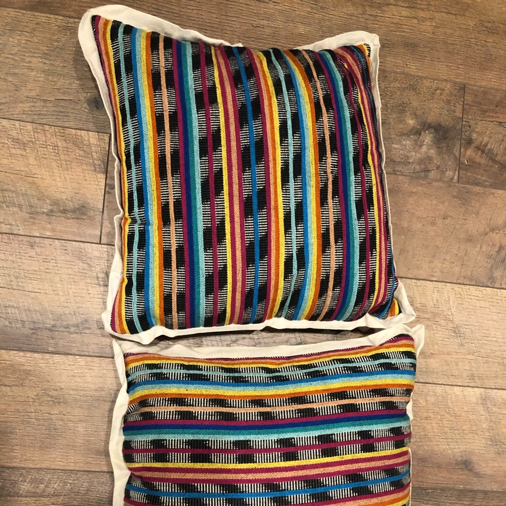 2 Aztec throw pillows. Used for decor.